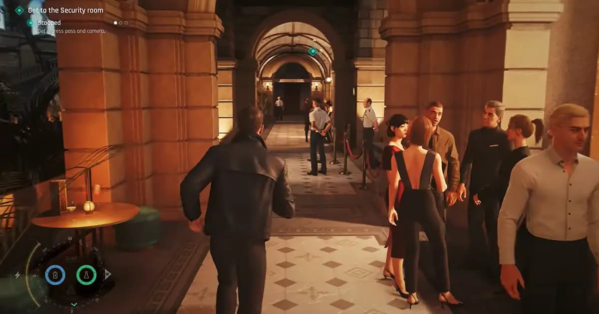 A man walks through a busy hotel corridor filled with guests, security staff and roped-off entrances.