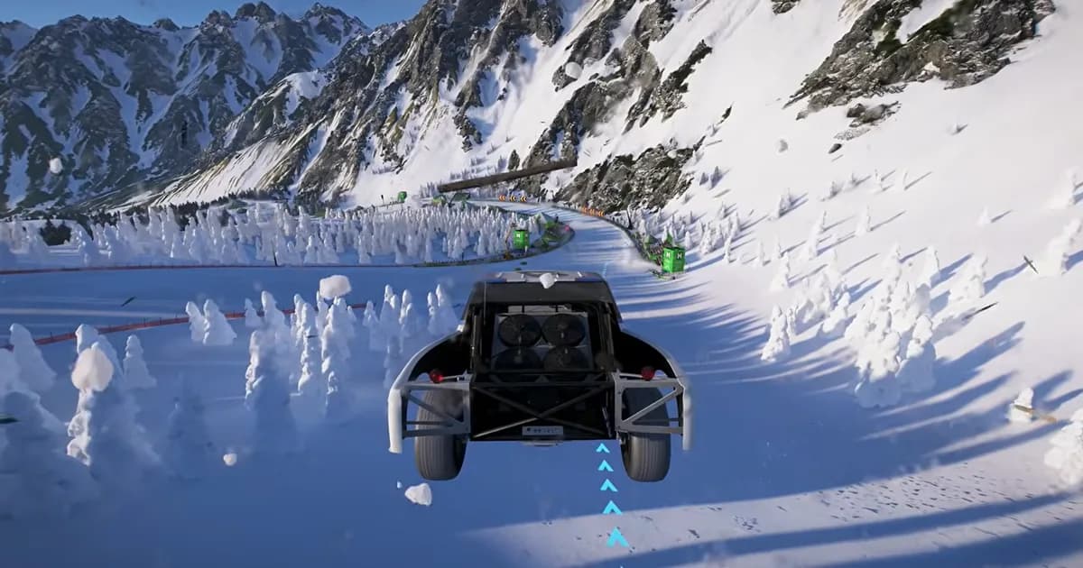 An off-road racing truck launches over a snowy mountain road surrounded by towering alpine peaks.