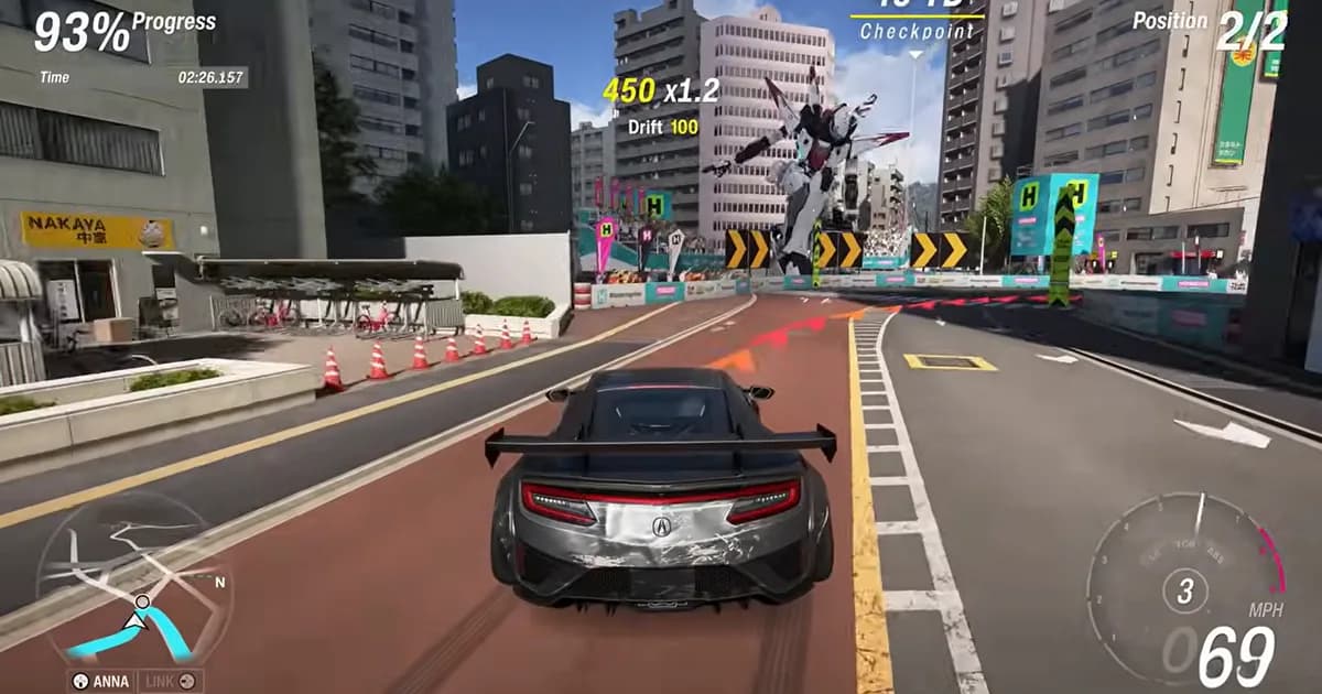 A sports car races through central Tokyo during a showcase event as a giant mech towers over the city streets.